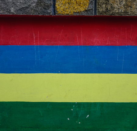 Mauritius flag painted on an old brick wall.の写真素材