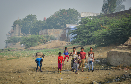 Agra, India - Nov 12, 2017. Children playing on the bank of Yamuna river in Agra, India.のeditorial素材