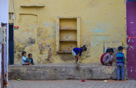 Agra, India - Nov 11, 2017. Children playing at street market near Taj Mahal in Agra, India.のeditorial素材