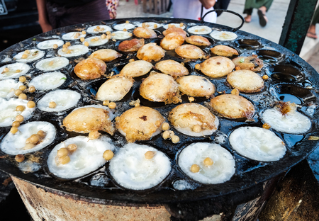 Selling street food at local market in Yangon, Myanmar.の写真素材