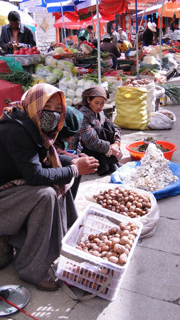 Tibet, China - Aug 30, 2012. Vendors at rural market in Tibet, China. Tibet is a historical region covering much of the Tibetan Plateau in Central Asia.のeditorial素材
