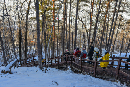 Heilongjiang, China - Feb 19, 2018. Tourists walking on a trail in Heilongjiang Province, Northernmost China.のeditorial素材