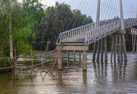 An Giang, Vietnam - Sep 2, 2017. River scenery with a bridge in An Giang, Vietnam. An Giang is a province in southern Vietnam, bordering Cambodia.のeditorial素材