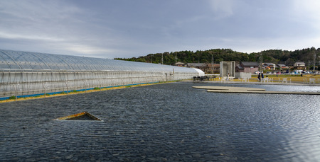 Nagoya, Japan - Mar 16, 2018. The pond for decorations at modern architecture of eco resort in Nagoya, Japan.のeditorial素材