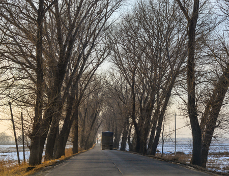 Harbin, China - Feb 25, 2018. Cars run on rural road in Harbin, China. Harbin is the capital of Heilongjiang province, Northeastern China.のeditorial素材