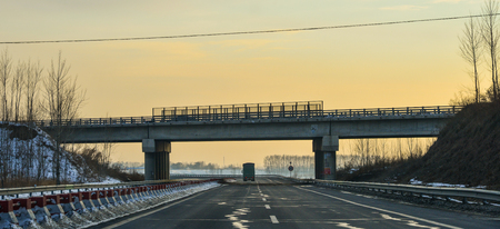 Harbin, China - Feb 25, 2018. Sunset on highway in Harbin, China. Harbin is the capital of Heilongjiang province, Northeastern China.のeditorial素材
