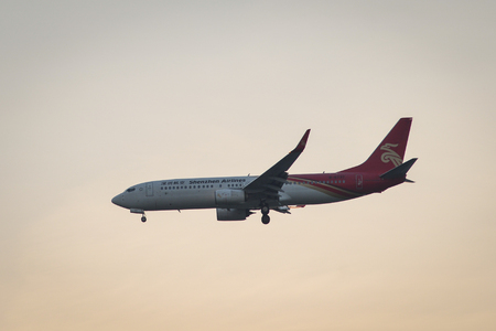Bangkok, Thailand - Apr 20, 2018. A passenger aircraft landing in sunset at Suvarnabhumi Airport (BKK) in Bangkok, Thailand.のeditorial素材