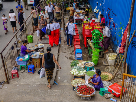 Yangon, Myanmar - Feb 26, 2016. People at street market in Yangon, Myanmar. Yangon is Myanmar largest city and its most important commercial centre.のeditorial素材