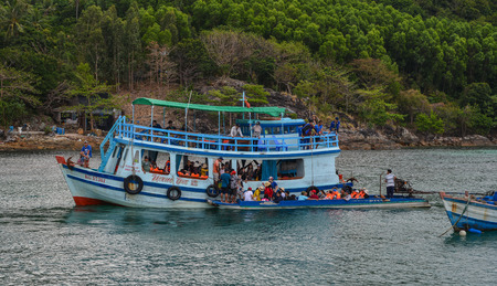 Kien Giang, Vietnam - Apr 6, 2018. Wooden boats carrying tourists on sea at sunny day in Kien Giang,...
