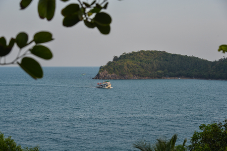 Kien Giang, Vietnam - Apr 6, 2018. A wooden ferry running on sea at sunny day in Kien Giang, Vietnam.のeditorial素材