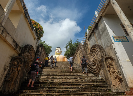 Dambulla, Sri Lanka - Sep 8, 2015. People visit the Giant Buddha in Dambulla, Sri Lanka. There are...