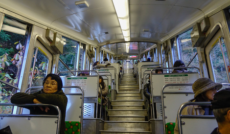 Osaka, Japan - Nov 24, 2016. Passengers sitting in a cablecar to Mount Koya in Osaka, Japan.のeditorial素材