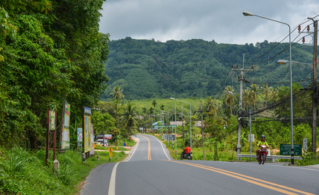 Phuket, Thailand - Apr 26, 2018. Traffic on road in Phuket, Thailand. Phuket lies off the west coast of Thailand in the Andaman Sea.のeditorial素材
