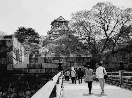 Osaka, Japan - Apr 7, 2014. People visit Osaka Castle (Osakajo) in spring time. The castle is one of...