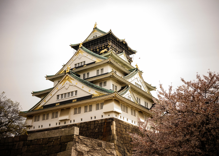 Osaka, Japan - Apr 7, 2014. View of Osaka Castle (Osakajo) with cherry flowers in spring time. The castle is one of Japan most famous landmarks.のeditorial素材