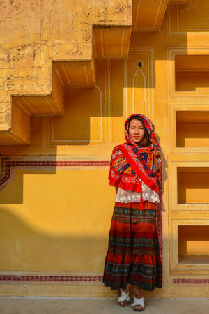 A young woman (travaler) standing at the ancient fort in Jaipur, India.のeditorial素材