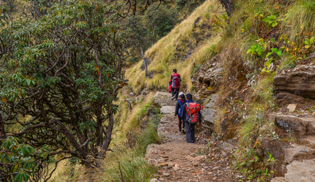 People with backpack walking on trail of Annapurna Circuit Trekking in Khopra, Nepal.の写真素材