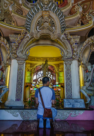 Bangkok, Thailand - Apr 22, 2018. A man praying at the Erawan Temple in Bangkok, Thailand.のeditorial素材