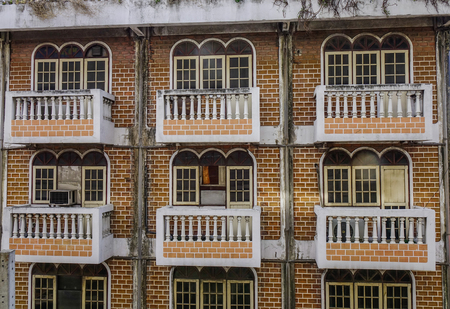 Old brick apartment located at downtown in Bangkok, Thailand.の写真素材