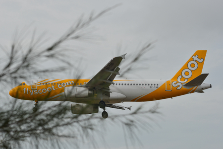 Phuket, Thailand - Apr 25, 2018. An Airbus A320 airplane of Scoot landing at Phuket International Airport (HKT).のeditorial素材