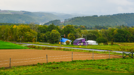 Rural houses with empty field at autumn in Biei, Japan.の素材 [FY310104267753]