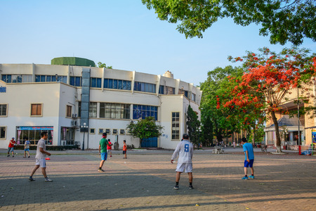 Hai Phong, Vietnam - May 22, 2016. Group of local men playing sport at the city park in Hai Phong, Vietnam.のeditorial素材