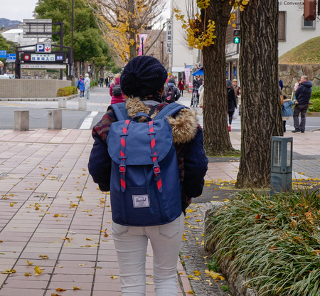 Himeji, Japan - Dec 27, 2015. A woman walking on street in Himeji, Japan. Himeji known for the...