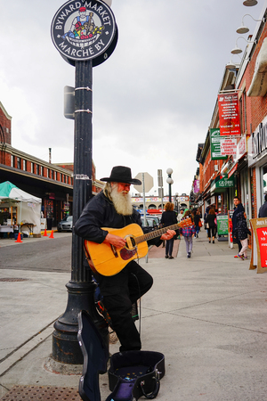 Ottawa, Canada - May 15, 2017. A man playing guitar on street in Ottawa, Canada. Queen Victoria chose Ottawa as the capital of Canada in 1857.のeditorial素材