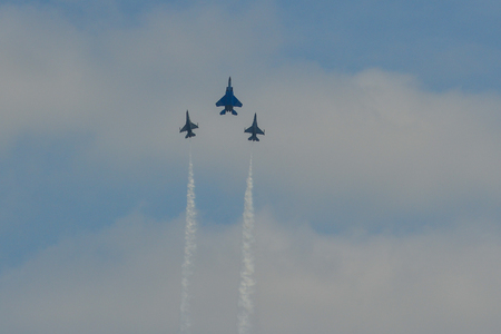 Singapore - Feb 10, 2018. Fighter aircarft team (F-15SG & F-16C) flying on display near Changi Air Base, Singapore.のeditorial素材