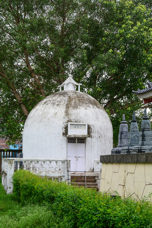 Bodhgaya, India - July 9, 2015. White stupa of Buddhist pagoda in Bodhgaya, India. Bodhgaya is the most revered of all Buddhist sacred sites.のeditorial素材
