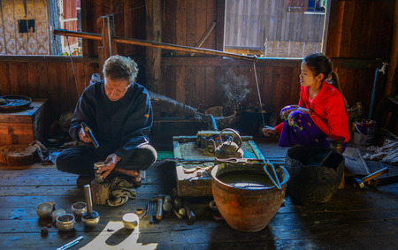 Inle Lake, Myanmar - Feb 7, 2018. People working at a weaving factory on Inle Lake, Myanmar. The Inle lake area is renowned for its weaving industry.のeditorial素材