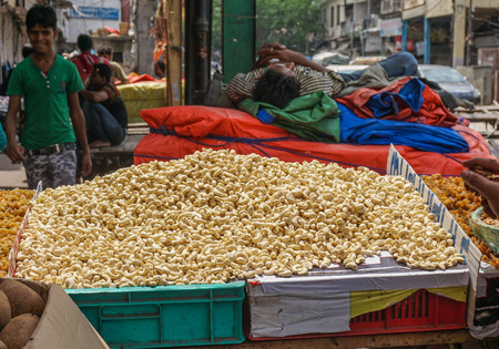 Delhi, India - Jul 27, 2015. Selling nuts at street market in Delhi, India. Delhi city proper population was over 11 million, the second-highest in India.のeditorial素材