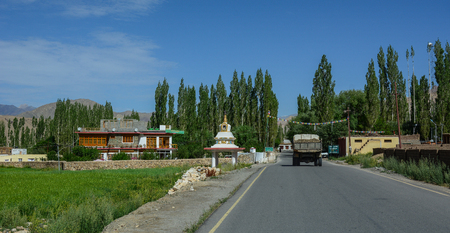 Leh, India - Jul 15, 2015. Vehicles running on mountain road in Leh, India. Leh is a town in the Indian state of Jammu and Kashmir.のeditorial素材
