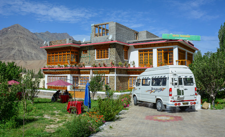 Leh, India - Jul 15, 2015. A tourist van parking at small hotel in Leh, India. Leh is a town in the Indian state of Jammu and Kashmir.のeditorial素材