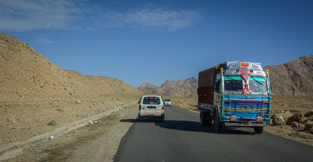Leh, India - Jul 15, 2015. Vehicles running on mountain road in Leh, India. Leh is a town in the Indian state of Jammu and Kashmir.のeditorial素材