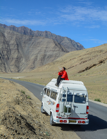 Leh, India - Jul 15, 2015. Traveler on tourist van with mountains in Leh, India. Leh is a town in the Indian state of Jammu and Kashmir.のeditorial素材