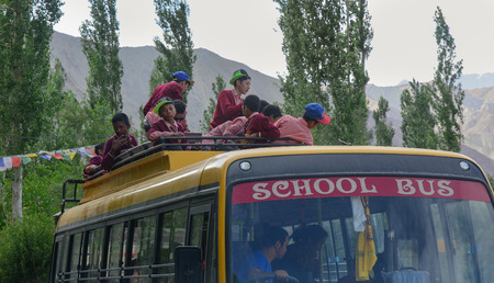 Leh, India - Jul 15, 2015. Students sitting on school bus in Leh, India. Leh is a town in the Indian state of Jammu and Kashmir.のeditorial素材
