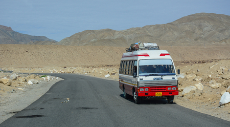 Leh, India - Jul 15, 2015. Vehicles running on mountain road in Leh, India. Leh is a town in the Indian state of Jammu and Kashmir.のeditorial素材