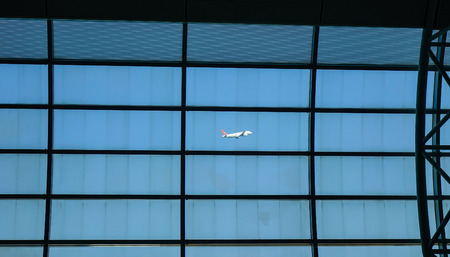Jeju, South Korea - Sep 21, 2016. Airplane taking off, view from Boarding Gate of Jeju International Airport (CJU).のeditorial素材