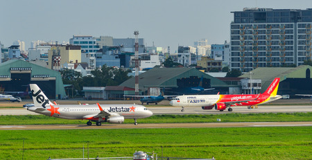 Saigon, Vietnam - Jun 26, 2018. Passenger airplanes taxiing on runway at Tan Son Nhat Airport (SGN) in Saigon (Ho Chi Minh City), Vietnam.のeditorial素材