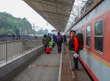 Nanning, China - Nov 2, 2015. Passengers waiting for the train at railway station Nanning, China. China railways are among the busiest in the world.のeditorial素材