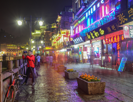 Hunan, China - Nov 5, 2015. Night view of Fenghuang Ancient Town in Hunan, China. Fenghuang (Phoenix) is still being kept in its original appearance with 300 years passed.のeditorial素材