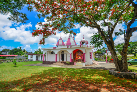 Port Louis, Mauritius - Jan 10, 2017. A Hindu temple with flamboyant tree in Port Louis, Mauritius. According to the 2011 Hinduism is the major religion at 51.9 percent.のeditorial素材