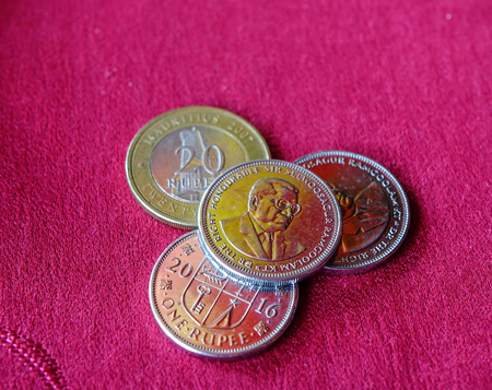 Mauritius Rupee (MUR) coins with red background - close up.