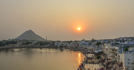 Pushkar, India - Nov 5, 2017. View of Pushkar lake and the town in sunset. Pushkar is a pilgrimage...
