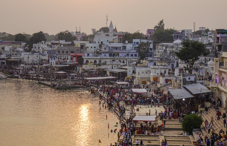 Pushkar, India - Nov 5, 2017. View of Pushkar lake and the town in sunset. Pushkar is a pilgrimage site for Hindus and Sikhs, located in state of Rajasthan.のeditorial素材