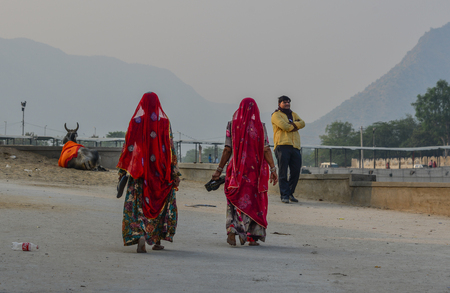 Pushkar, India - Nov 5, 2017. Indian women at holy site in Pushkar, India. Pushkar is a pilgrimage site for Hindus and Sikhs, located in State of Rajasthan.のeditorial素材