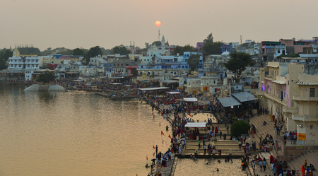 Pushkar, India - Nov 5, 2017. View of Pushkar lake and the town in sunset. Pushkar is a pilgrimage site for Hindus and Sikhs, located in state of Rajasthan.のeditorial素材