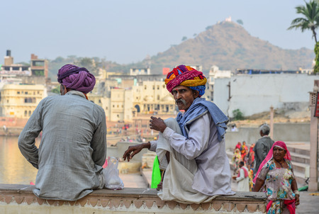 Pushkar, India - Nov 5, 2017. Local man relaxing on street in Pushkar, India. Pushkar is a pilgrimage site for Hindus and Sikhs, located in State of Rajasthan.のeditorial素材