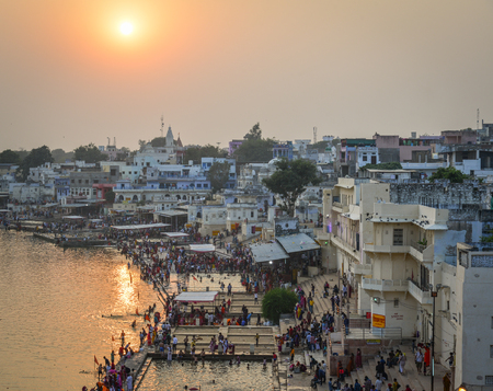 Pushkar, India - Nov 5, 2017. View of Pushkar lake and the town in sunset. Pushkar is a pilgrimage site for Hindus and Sikhs, located in state of Rajasthan.のeditorial素材